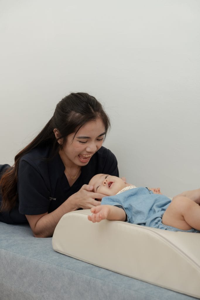 Pei Yun checking baby cranial (chiropractic)