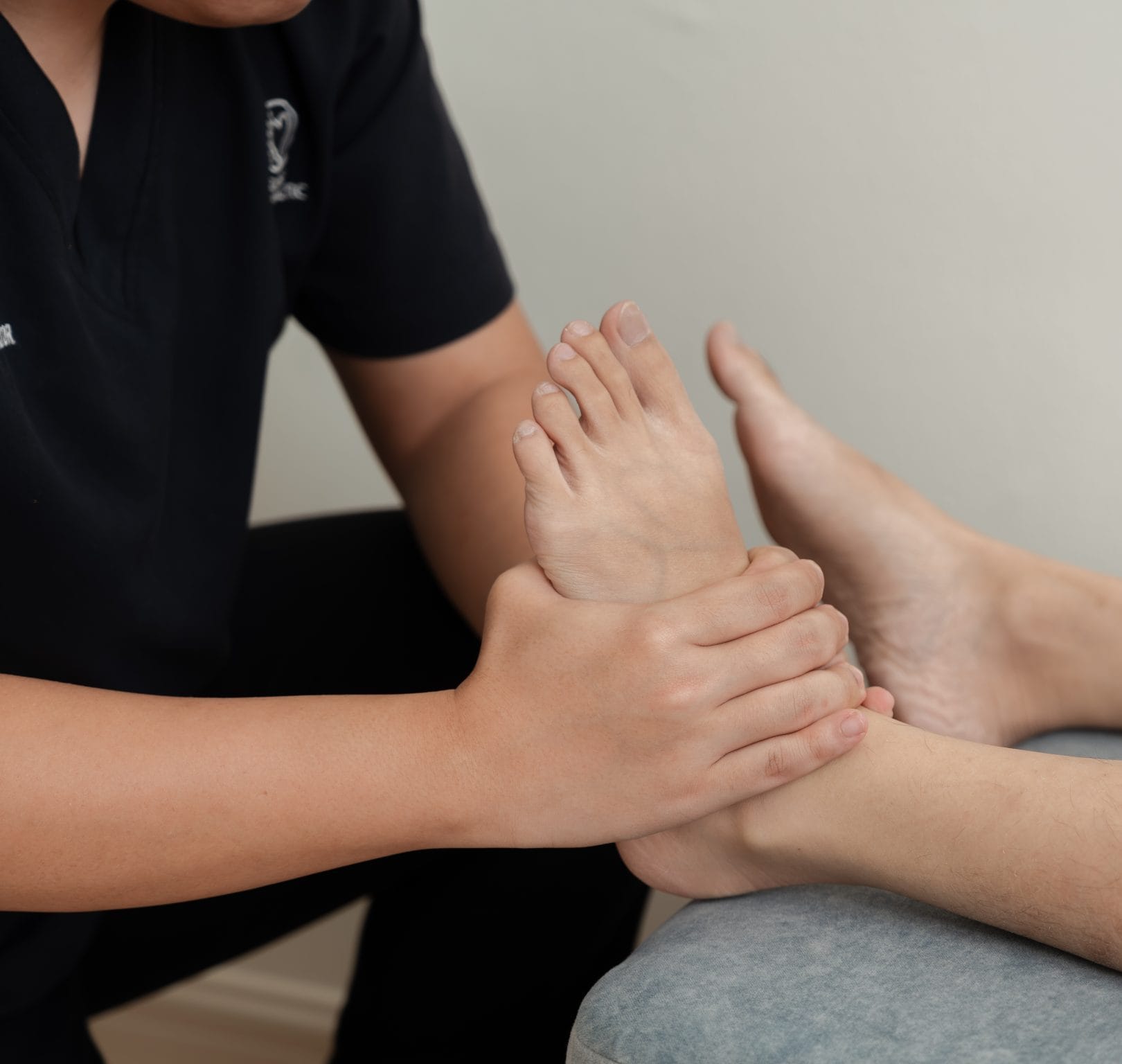 Yeo is performing a ankle adjustment on a ankle sprain patient