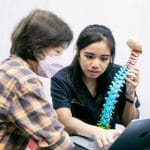 pei yun sharing about neck knowledge with a patient