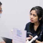 Pei Yun is asking the patient about his pain and condition